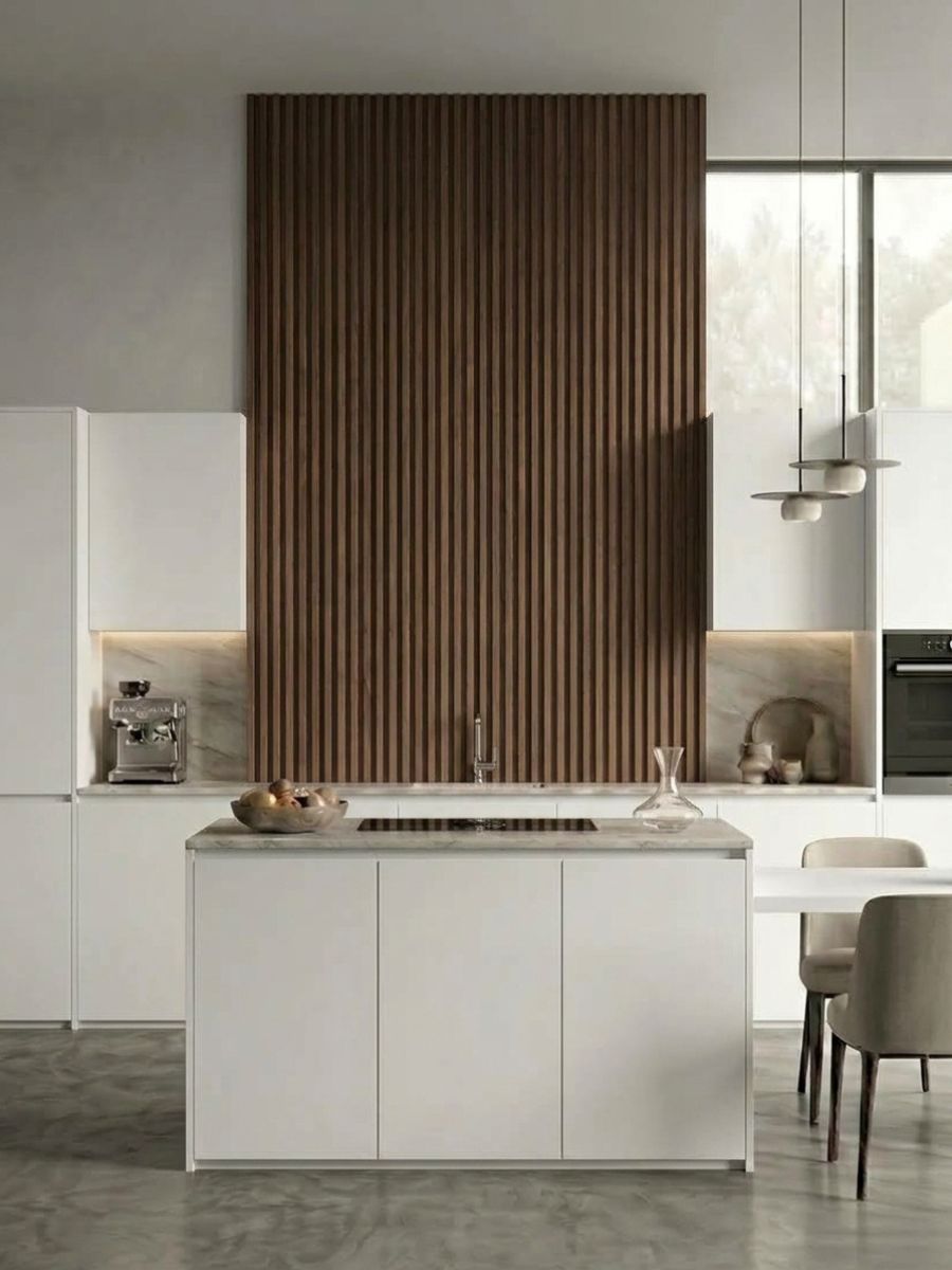Tall walnut WPC fluted 3D accent wall behind a white modern kitchen island