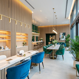Contemporary commercial interior lined with light oak acoustic wood slat wall panels