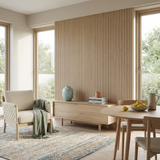 Oak acoustic wood slat panel accent wall in a bright living and dining area