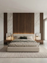 Walnut WPC fluted wall panels framing a bedroom headboard with marble-look accents