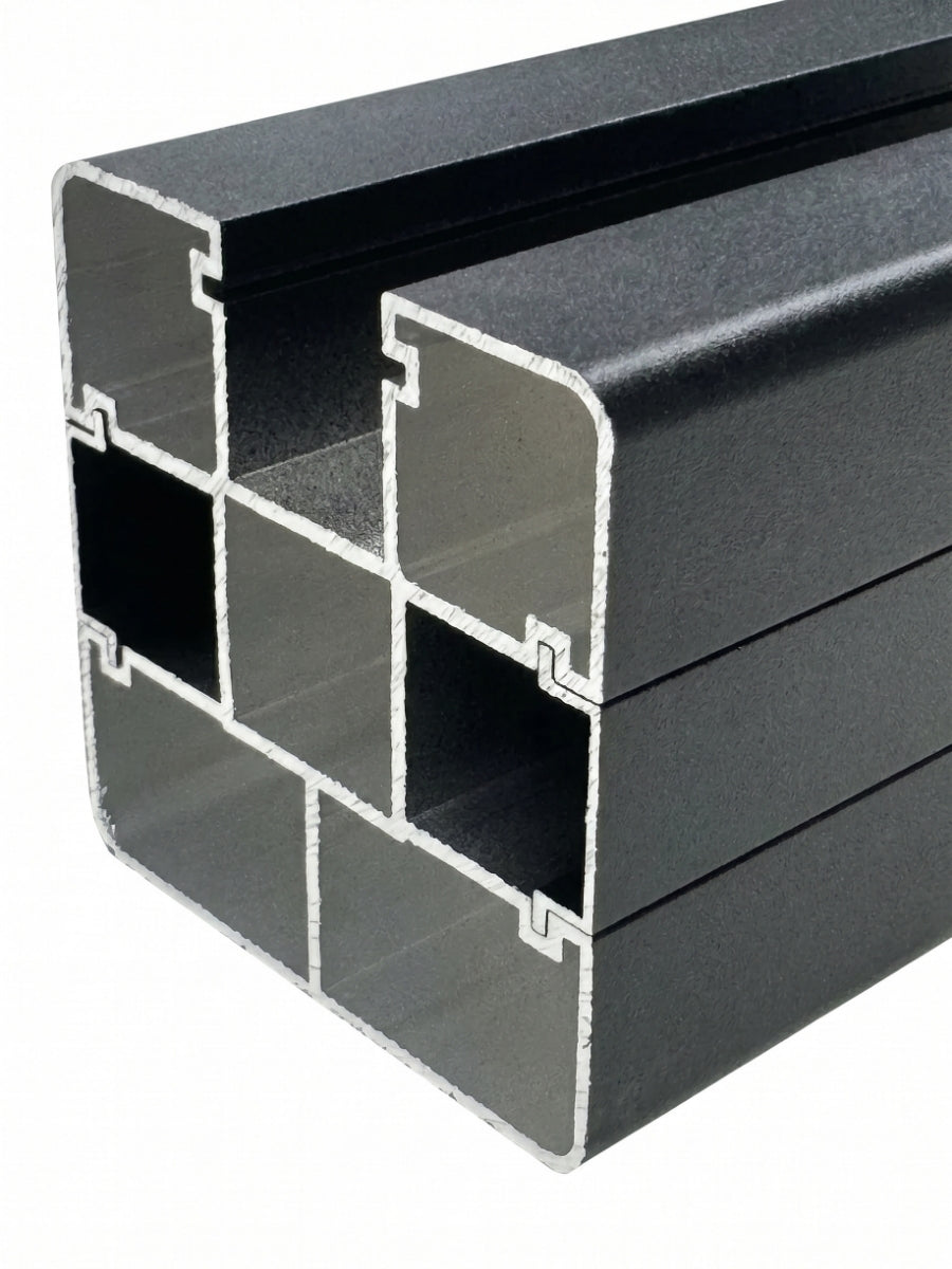 Cutaway close-up of the dark aluminum alloy fence post showing its hollow multi-channel profile
