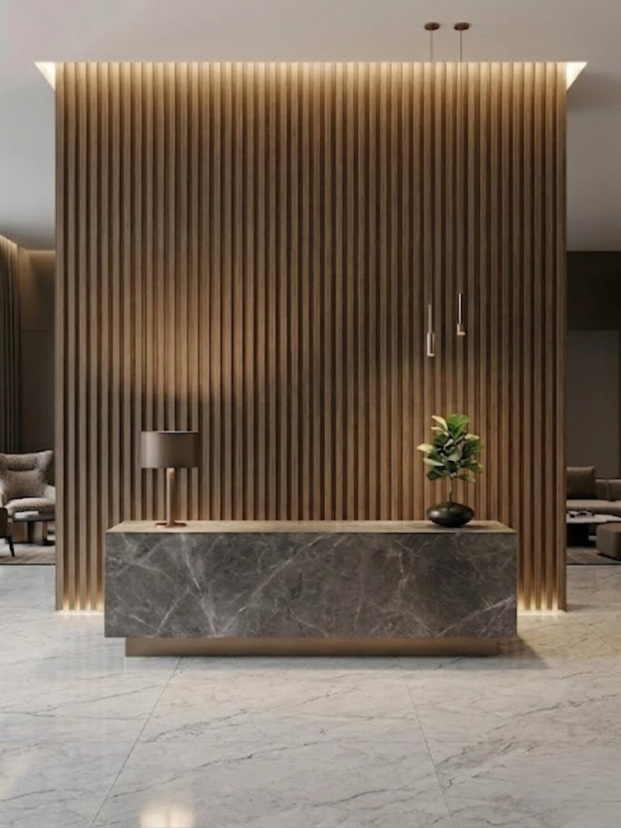 Royal Oak WPC fluted panel feature wall with integrated lighting behind a marble reception desk