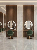 Walnut WPC fluted wall panels behind illuminated round mirrors at salon styling stations