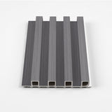 Oak Gray WPC fluted 3D wall panel sample with raised channels and visible hollow profile