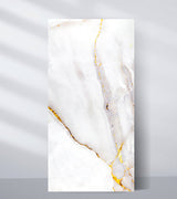 White PVC marble sheet sample with pale gray and blush veining edged in gold