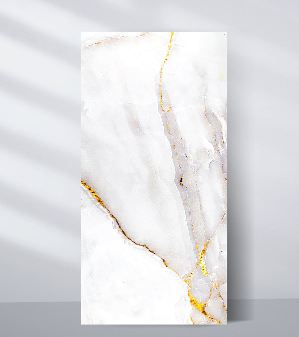 White PVC marble sheet sample with pale gray and blush veining edged in gold