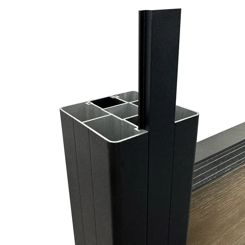 Open fence post cross-section with a vertical trim piece inserted into the side channel beside a fence panel