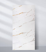 White PVC marble sheet sample with thin diagonal gray and caramel-colored veins