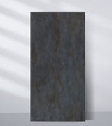 Dark charcoal PVC sheet sample with a mottled blue-gray and rust-toned industrial finish