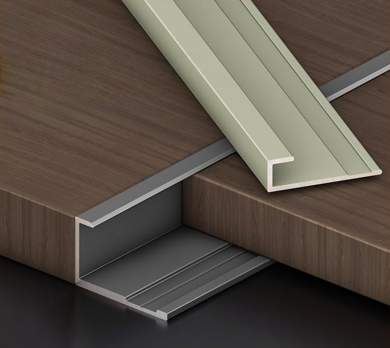Silver and champagne 3mm aluminum end cap trim profiles arranged with dark wood-look PVC wall panels