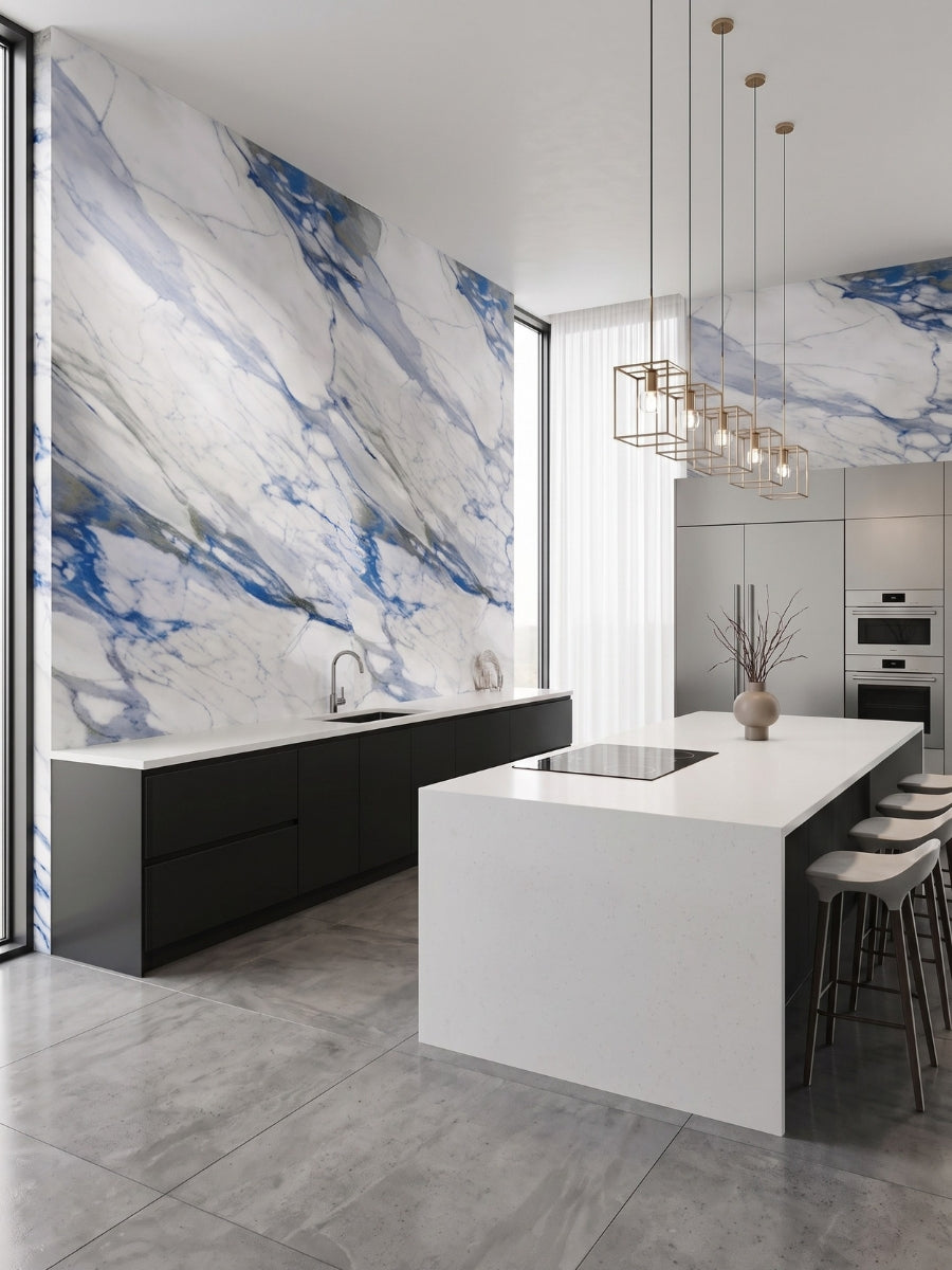 Modern kitchen with blue-veined Calacatta Azur PVC marble sheet walls, black cabinetry, and a white island