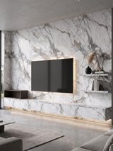 White and gray deep-vein PVC marble sheets covering a living room TV wall with floating shelves