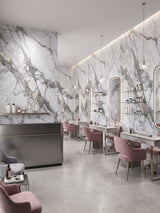 Salon interior with deep-vein PVC marble sheets behind illuminated mirrors and styling stations