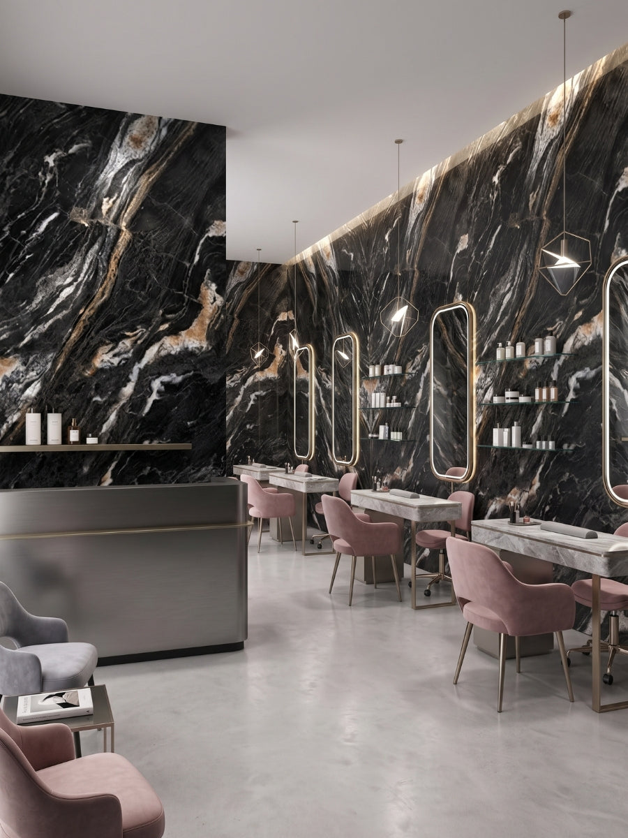 Contemporary salon with Doral Night marble PVC wall panels, illuminated mirrors, and pink chairs