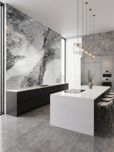 Frosted Sky marble PVC wall panel with bold gray veining installed behind black kitchen cabinetry