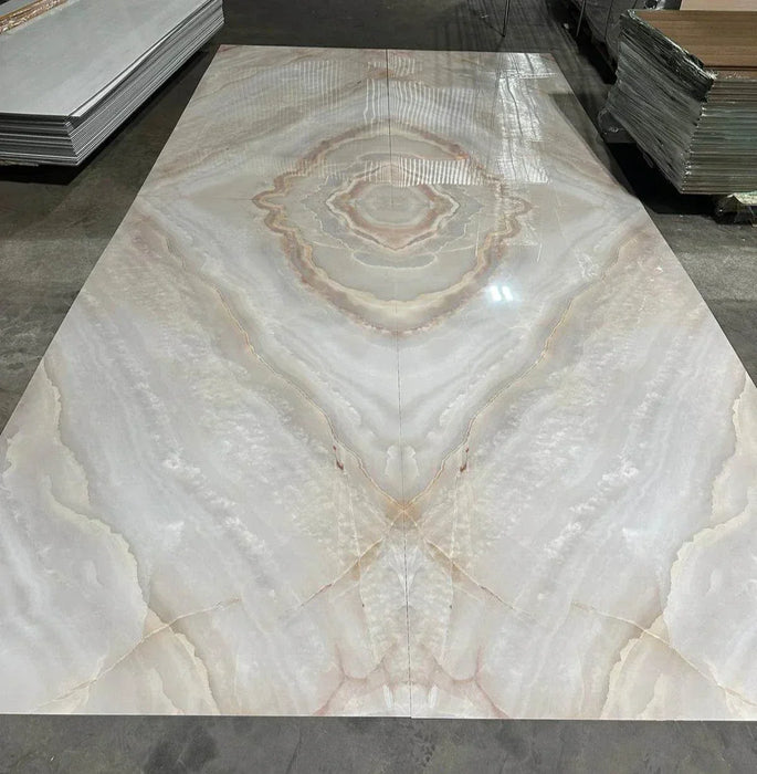 Luxurious beige and gold veined marble sheet with mirrored effect