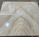 Polished beige and gold marble slab with mirrored 3D veins