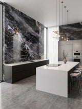 Modern kitchen with 3D Zena black marble PVC wall panels, white island, and black cabinetry