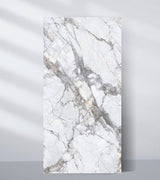 White PVC marble sheet sample with deep intersecting gray veins and subtle gold accents