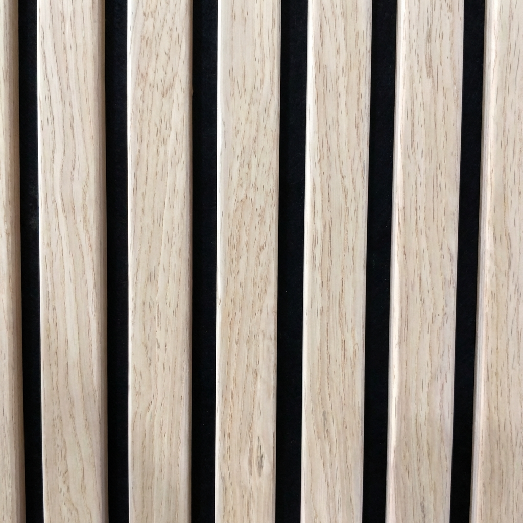 Close-up of oak wood grain slats with black acoustic backing between them