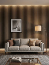 Royal Oak WPC fluted 3D wall panels installed behind a gray sofa in a modern living room