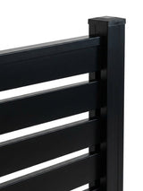 Close-up of black aluminum fence slats secured to the capped post