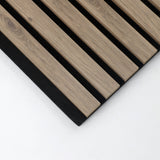 Corner detail of white oak acoustic slats with veneered faces and edges on black backing