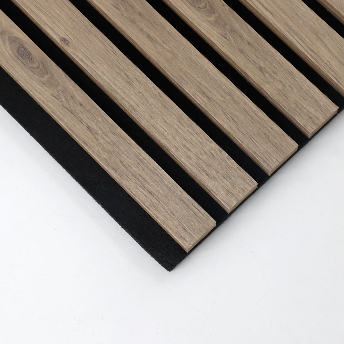Corner detail of white oak acoustic slats with veneered faces and edges on black backing
