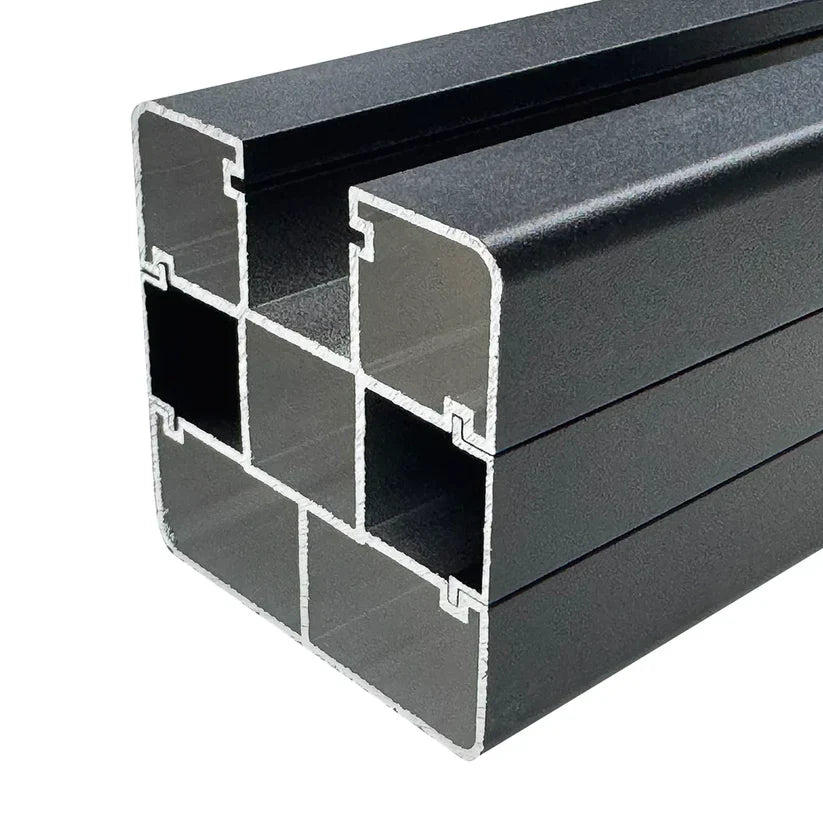 Close-up cross-section of the dark gray in-ground fence post with hollow chambers and side channels