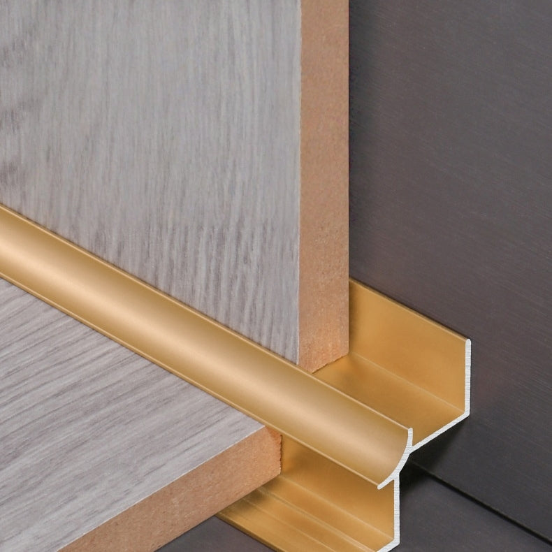 Gold 3mm aluminum inside corner trim fitted around wood-look panel edges