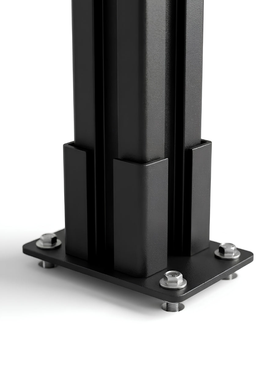 Close-up of the black above-ground fence post base plate secured with mounting hardware