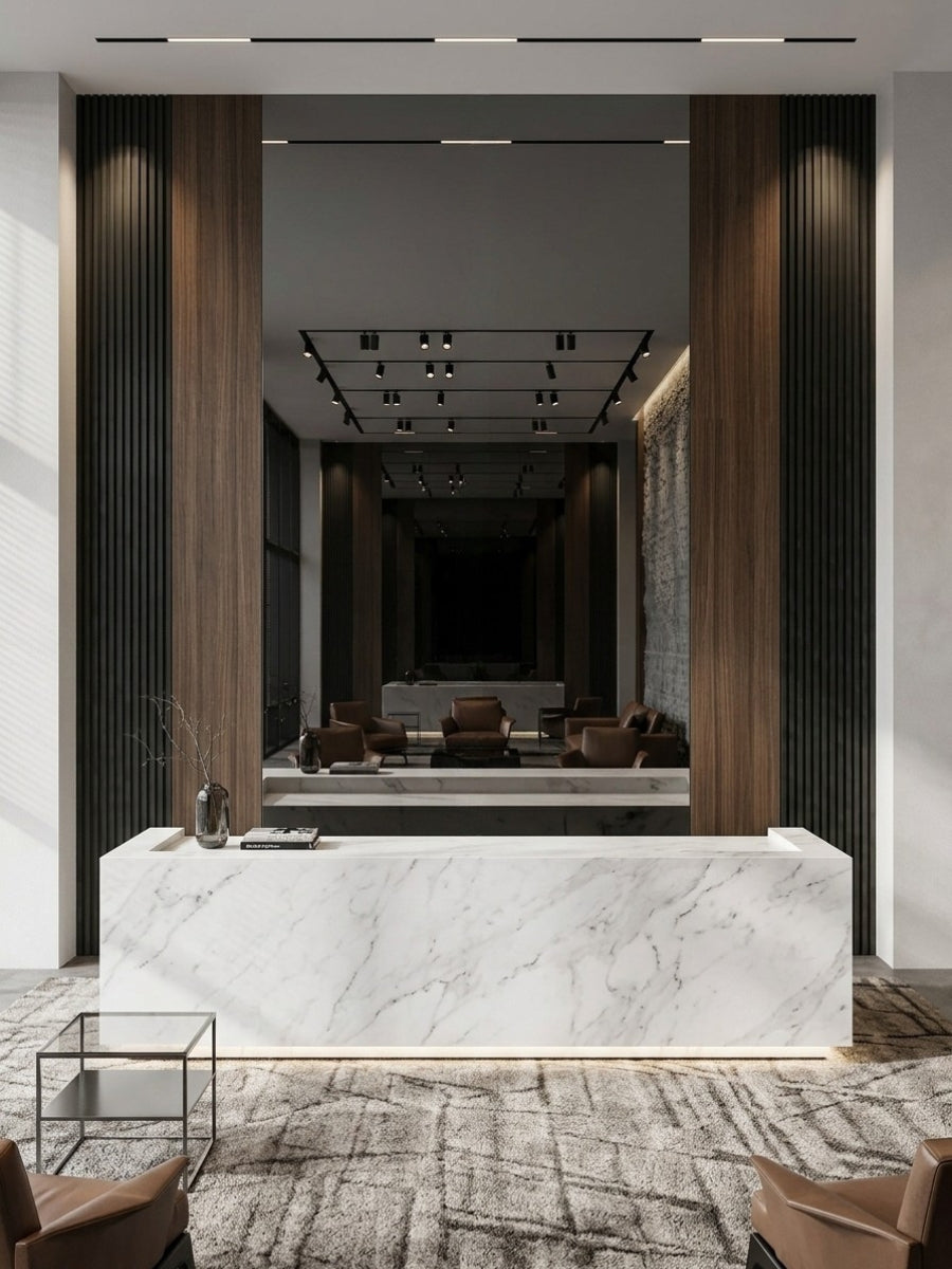 Large Black Mirror wood veneer panel framed by dark wood and fluted sections behind a marble reception desk