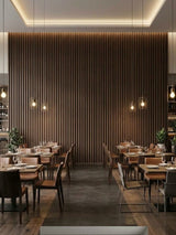 Floor-to-ceiling walnut WPC fluted feature wall in a modern restaurant dining area