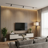 Natural oak acoustic wood slat TV wall with warm lighting in a modern living room