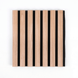 Front view of a natural wood acoustic wall panel with evenly spaced slats on black backing