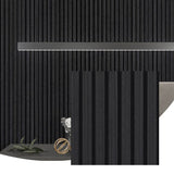 Black acoustic wood wall panel installed as a vertical slat feature in a dark modern interior