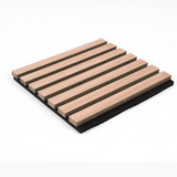 Angled view of a natural wood acoustic panel with parallel slats mounted on black backing