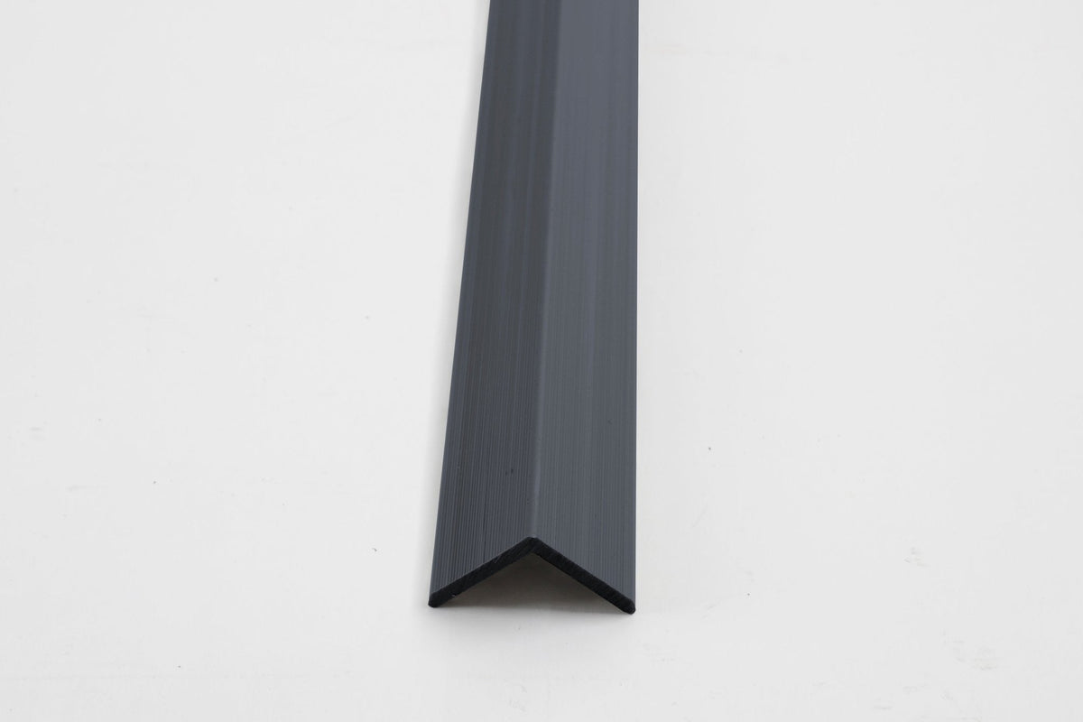 Dark gray aluminum corner trim profile for wall panel edge finishing