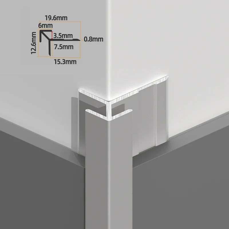 Silver aluminum outside corner trim installed over wall panels with angular profile dimensions