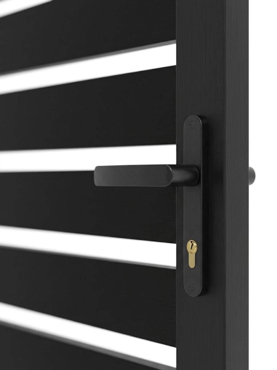 Close-up of the black handle and keyed lock on the aluminum fence gate