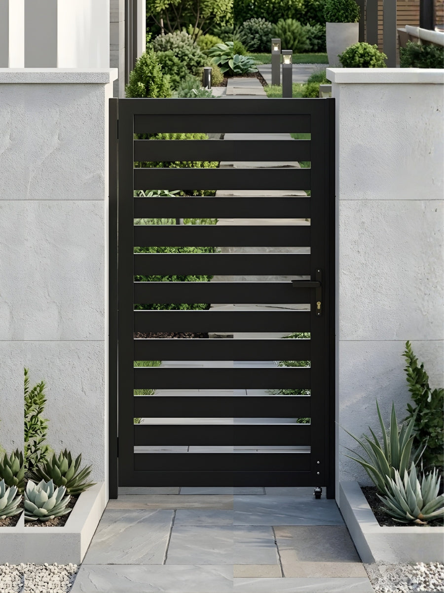 Closed black aluminum semi-privacy gate installed between white garden walls