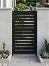 Closed black aluminum semi-privacy gate installed between white garden walls