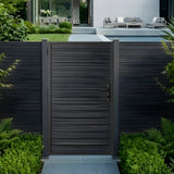 Modern aluminum privacy gate and matching fence installed beside a landscaped pool area