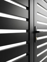 Close-up of black aluminum gate slats, frame, and handle hardware