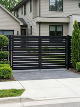 Modern black aluminum semi-privacy double gate installed at a residential driveway