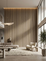 Tall ash wood veneer feature wall with vertical grain and concealed lighting in a contemporary living room