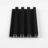 Ashen Oak WPC fluted wall panel sample in black with a subtle wood-grain texture