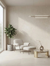Natural beige rough-texture PVC wall panels in a minimalist living room with an armchair and plant