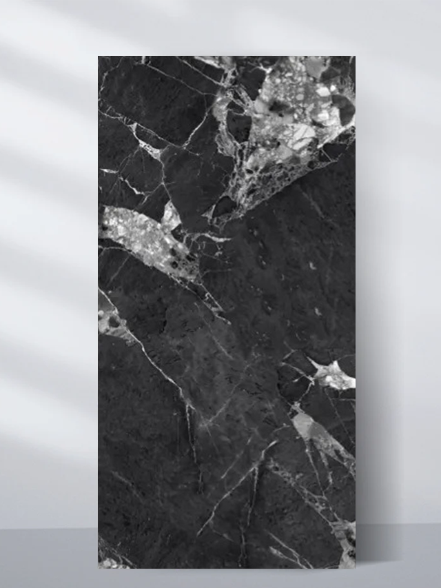 Black PVC marble sheet sample with angular white and gray fractured veins