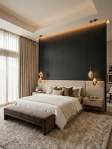 Blackwood veneer wall panels forming a dark wood-grain accent wall behind a modern upholstered bed